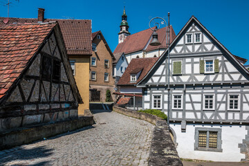 Old historical buildings and a road made of paving stones