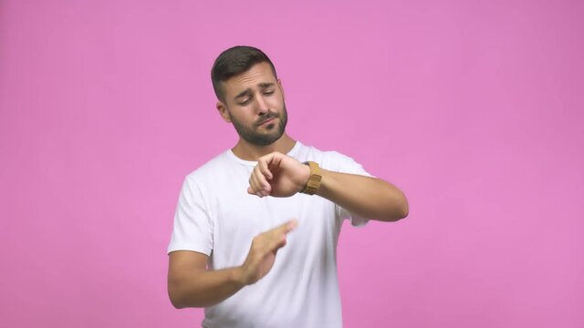 Young caucasian handsome man tired and bored, doing a timeout gesture, needs to stop because of work stress, time concept