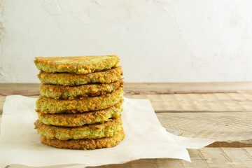 A stack of veggie burgers with chickpeas and vegetables. Vegetarian food concept. Copy space.