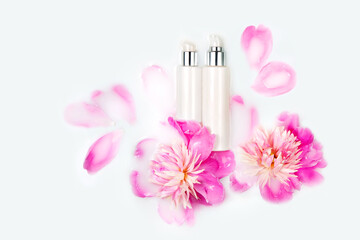 Natural cosmetic product. Cream and peony flower in a bath with milk. Conceptual photo: the best cosmetic tool for body and face care. Gentle care, mockup.