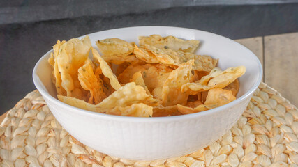 Crispy salty snacks on wooden background. close up shot