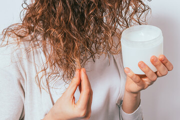 Female's hands apply cosmetic coconut oil