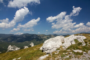Hiking Velebit mountain in Croatia in summer, Velebit peaks Visibaba Kiza, Bacic kuk mountain rocks at Dabarski kukovi