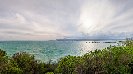 Tsemesskaya bay on the shore of which the city of Novorossiysk is located. In Novorossiysk there are passenger, cargo ports and oil-loading harbor. Panoramic photo. Krasnodar region.