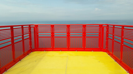 Wind turbine nacelle offshore helipad with yellow and red colors and empty background