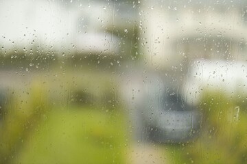Beautiful view of raindrops running on window glass. Beautiful nature backgrounds.