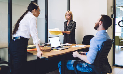 Group of colleagues discussing business project