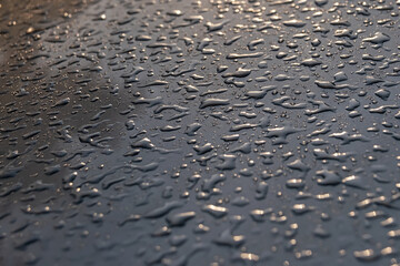 water drops on metal in the sun