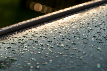 water drops on metal in the sun
