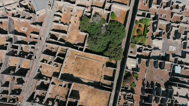Aerial view of ruins of Pompeii, ancient Roman city destroyed by volcanic eruption of volcano Mount Vesuvius - landscape panorama of Naples from above, Campania, Italy, Europe