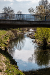 Bridge above the river and cloudy sky