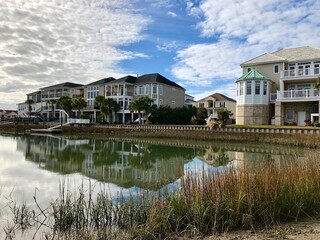 Obraz premium Waterfront luxury townhouse next to the Heritage Shores Nature Preserve, located at entrance to the park, in North Myrtle Beach, South Carolina. 