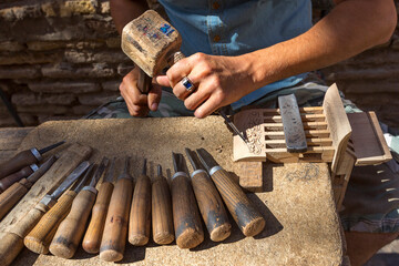 Artist carving the wood in Tashkent, Uzbekistan.