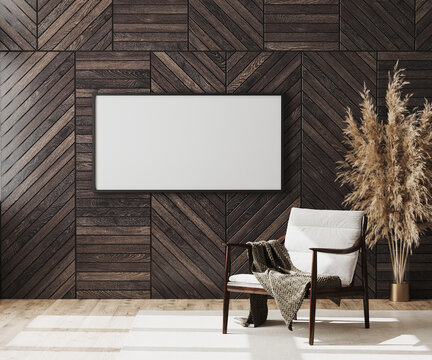 Blank picture frame mock up in empty modern room interior background with wooden decorative panel on the wall and wooden chair with blanket, living room interior background, 3d rendering