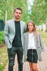 Fototapeta premium Father and cute daughter outdoor at fall
