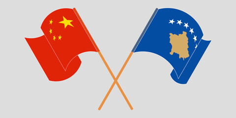 Crossed and waving flags of Kosovo and China