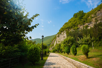 Beautiful stone-paved path among the high mountains on a bright sunny day in the montenegrin mountains of europe
