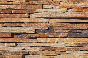 The wall is lined with brown old slate slabs.