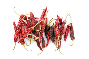 Dried Mexican red hot Chile Guajillo chili offered as close-up on white background with copy space - free-form select