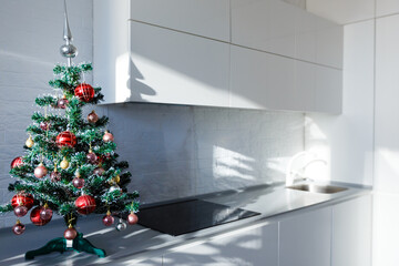 Interior light grey kitchen christmas decor. Preparing lunch at home on the kitchen concept