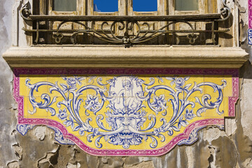 panels of polychrome azulejos on the walls of a beautiful ruined house in Setubal