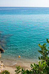 Aegean sea beach colors with transparent blue water in Ikaria
