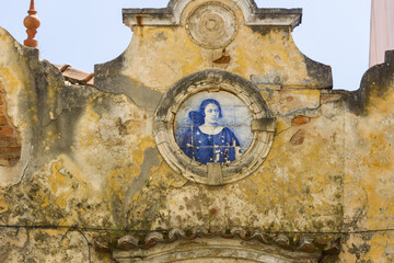 panels of blue and white azulejos on the walls of a beautiful ruined house in Setubal