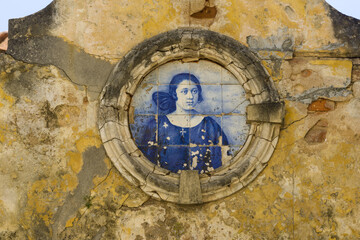 panels of blue and white azulejos on the walls of a beautiful ruined house in Setubal