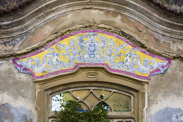 panels of polychrome azulejos on the walls of a beautiful ruined house in Setubal