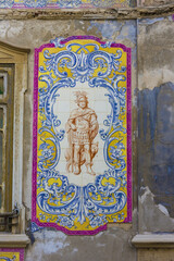 panels of polychrome azulejos on the walls of a beautiful ruined house in Setubal