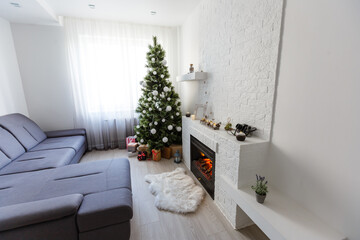 Fototapeta na wymiar Christmas tree in modern living room warm feeling