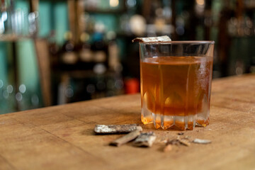 glass of drink on bar counter