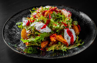 Plate of fresh salad with grilled chicken, pear, cream cheese in plate