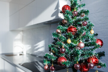 Interior light grey kitchen christmas decor. Preparing lunch at home on the kitchen concept