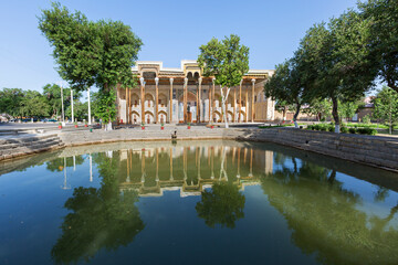 Fototapeta na wymiar Bolo Hauz Mosque and its reflection in the pond, in Bukhara, Uzbekistan