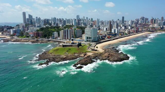 Seascape of Salvador, Bahia, Brazil. Coastal city view. Farol da Barra, lighthouse. Seascape of coastal city, lighthouse view. Farol da Barra view. Lighthouse scene. Seascape of Farol da Barra.
