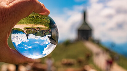 Crystal ball alpine landscape shot at the famous Wallberg summit near Tegernsee, Bavaria, Germany