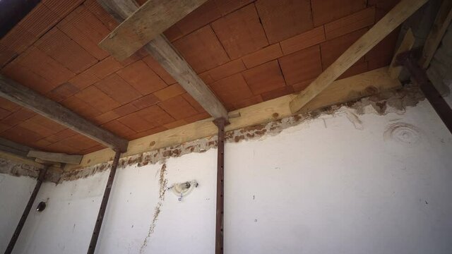 Wooden shuttering with props. Wooden shuttering supported by props set up for casting concrete slab