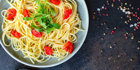spaghetti pasta tomato salad vegetables macaroni semola durum wheat on the table serving size top view place copy space for text