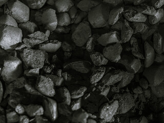 charcoals for barbecue in the grill, coals factory black and white photo