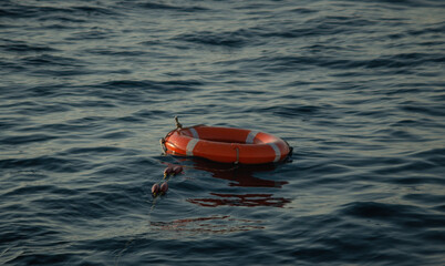 red lifebuoy thrown overboard in the black sea