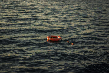 red lifebuoy thrown overboard in the black sea