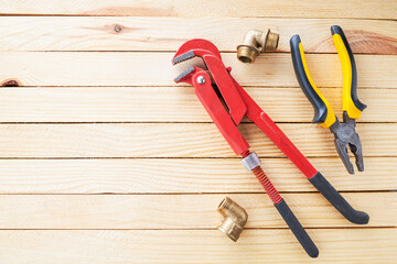 domestic plumber accessories set on a wooden desk. tools for housework