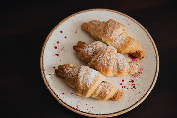 Fresh crispy croissants with berry jam.