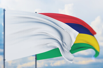 White flag on flagpole waving in the wind and flag of Mauritius. Closeup view, 3D illustration.