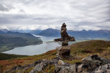 Cairns rocks on top of a Mountain during cloudy day. Taken in Carcross, near Whitehorse, Yukon, Canada.