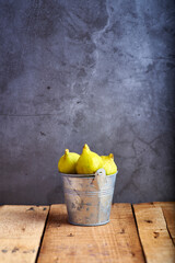 freshly harvested figs on a rustic wooden table ready to eat