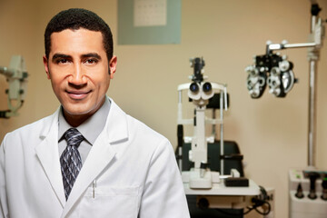 Optician standing in examination room