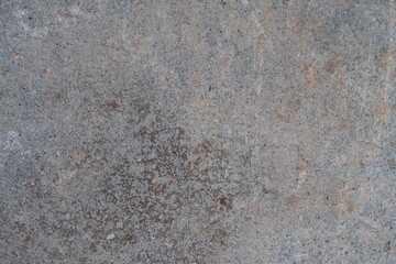 Smooth concrete slab surface touched by dark mold