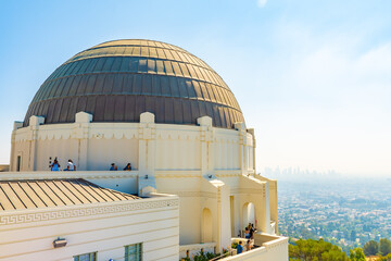 Fototapeta premium Entrance to Griffith Observatory in Los Angeles, California, famous tourist attraction and landmark park in the city hills on Mount Hollywood